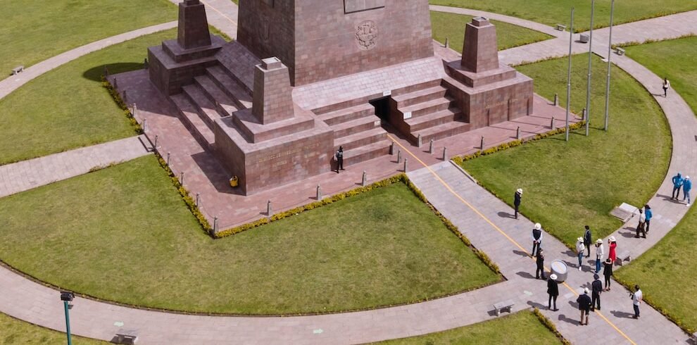 gray concrete statue on green grass field during daytime